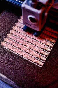 Close-up of a 3D printer creating intricate patterns. Focus on precision and technology.